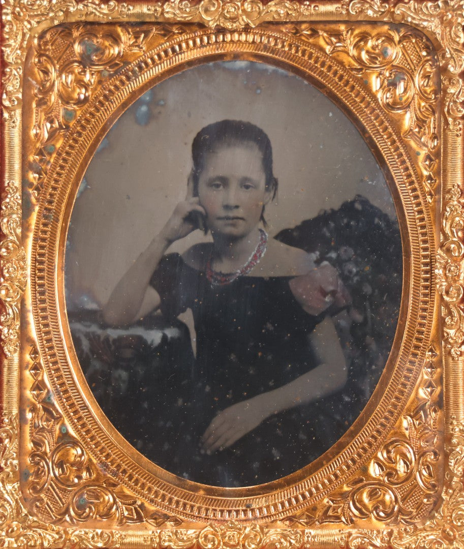 Lot 046 - Antique 1/6th Plate Ruby Ambrotype Photograph Of Pretty Young Girl In Off-Shoulder Dress With Jewelry, Posed Resting Hand Against Head, In Full Split Leatherette Union Case