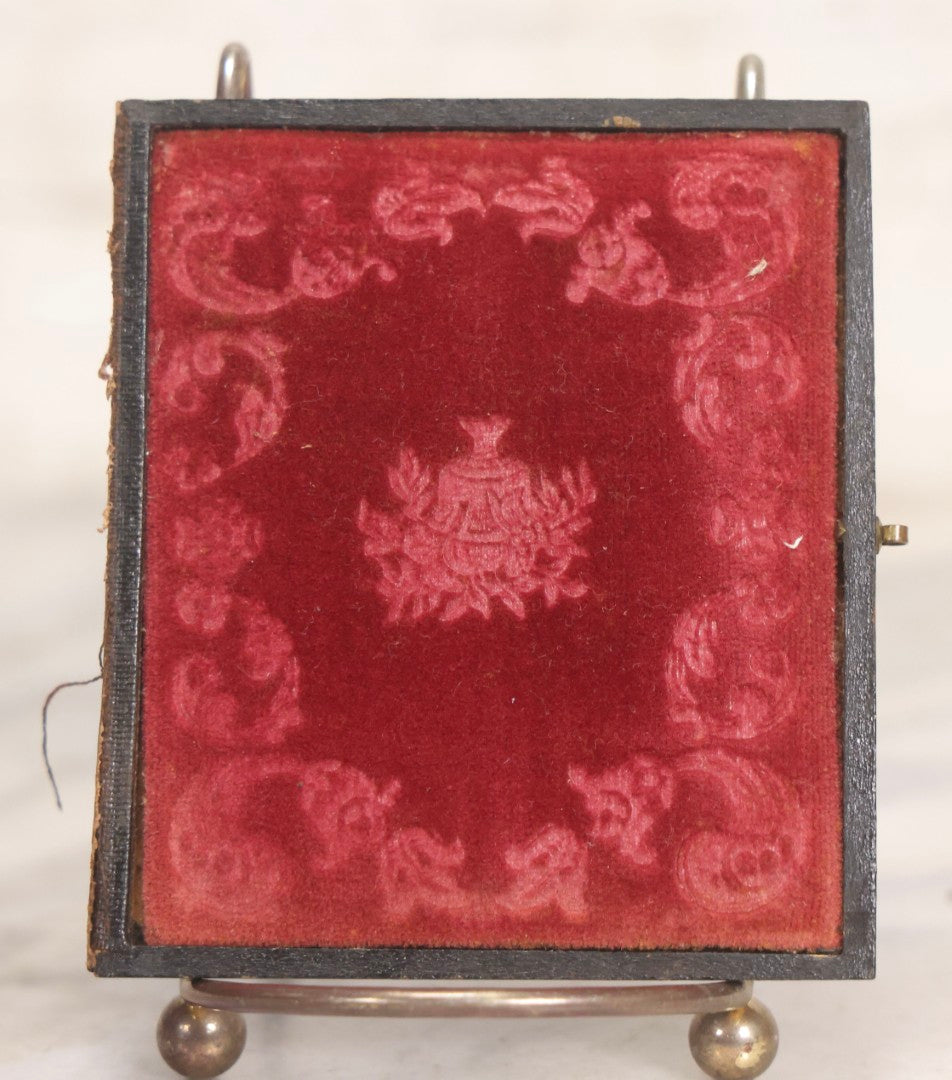 Lot 047 - Antique 1/6th Plate Ruby Ambrotype Photograph Of Elderly Woman In White Bonnet Holding Object, Possibly A Book, In Full Split Leatherette Union Case