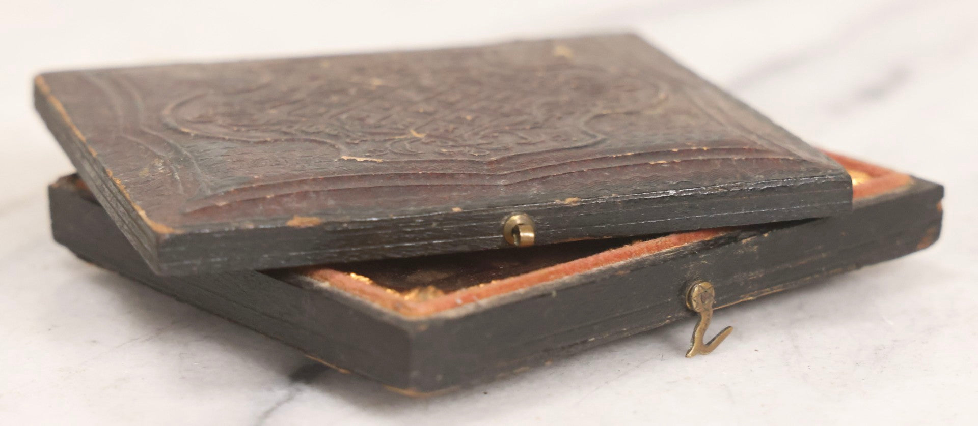 Lot 047 - Antique 1/6th Plate Ruby Ambrotype Photograph Of Elderly Woman In White Bonnet Holding Object, Possibly A Book, In Full Split Leatherette Union Case