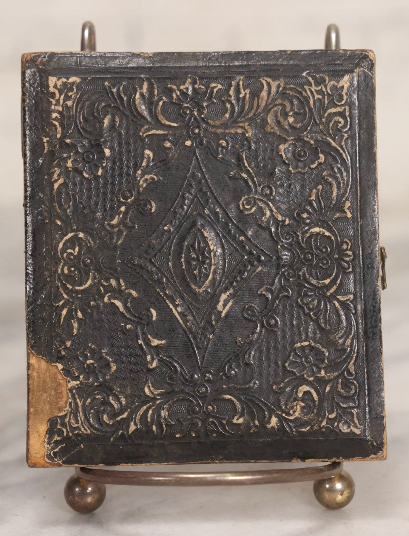 Lot 048 - Antique 1/6th Plate Ruby Ambrotype Photograph Of Skeptical-Looking Middle-Aged Man In Bowtie, White Shirt, And Blazer, In Half Leatherette Union Case