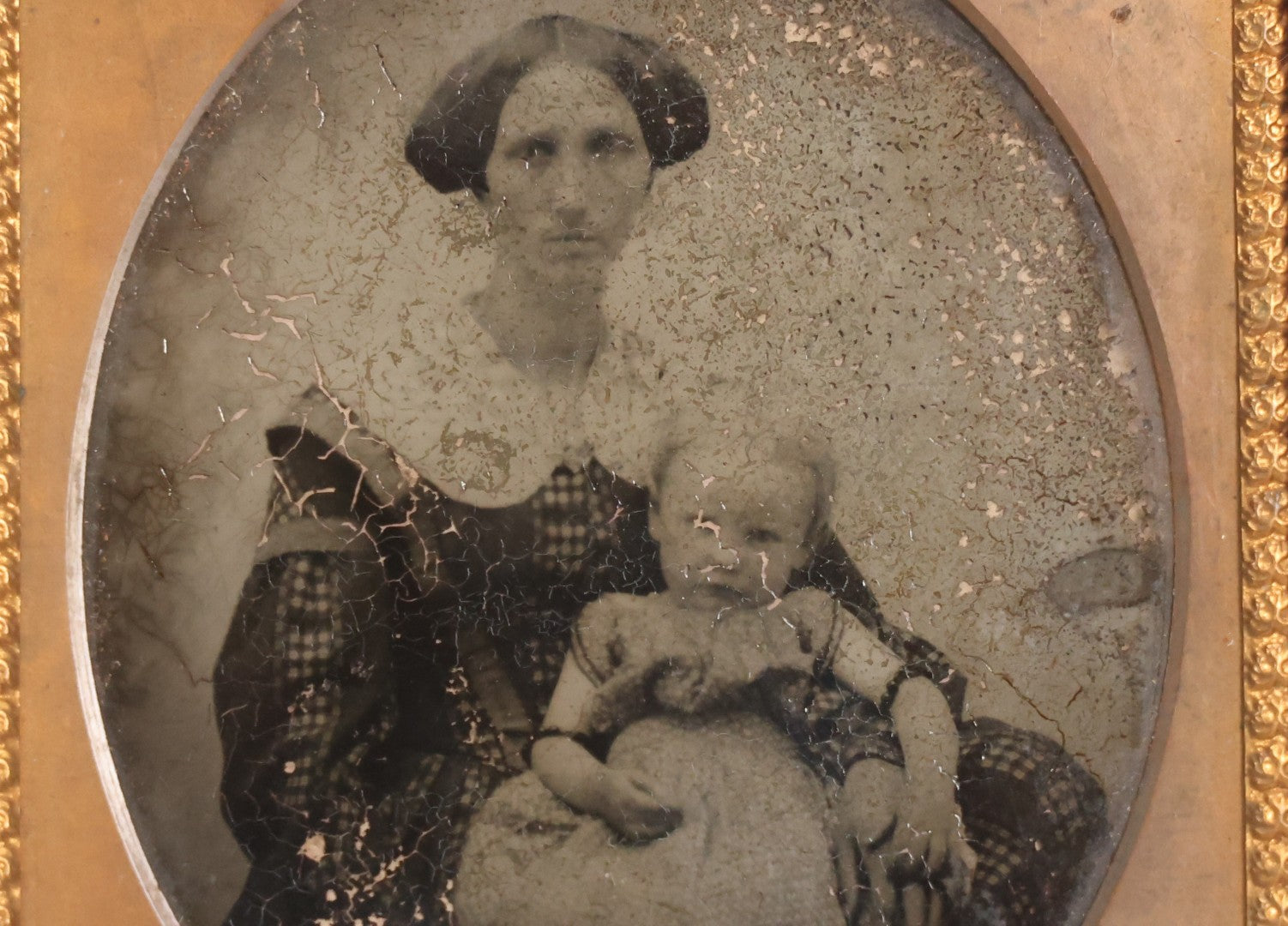 Lot 049 - Antique 1/6th Plate Ambrotype Photograph Of Seated Woman With Baby In Half Leatherette Union Case, Note Poor Condition