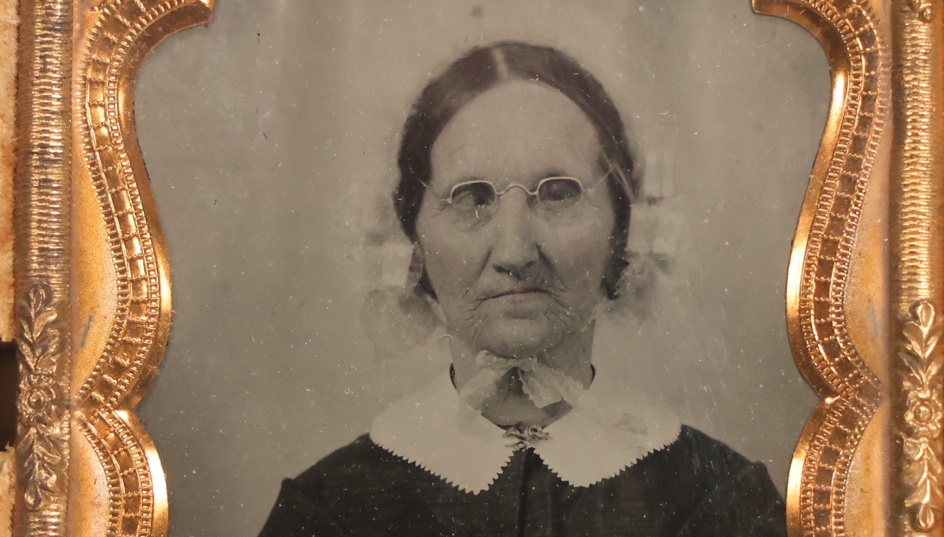 Lot 050 - Pair Of Antique 1/9th Plate Ruby Ambrotype Photographs Of Elderly Married Couple In Littlefield, Parsons & Co. Double Thermoplastic Union Case, Patented 1856–1857, With Herald Design