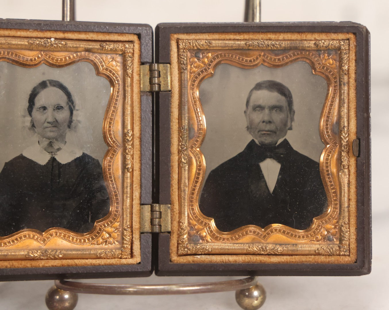 Lot 050 - Pair Of Antique 1/9th Plate Ruby Ambrotype Photographs Of Elderly Married Couple In Littlefield, Parsons & Co. Double Thermoplastic Union Case, Patented 1856–1857, With Herald Design