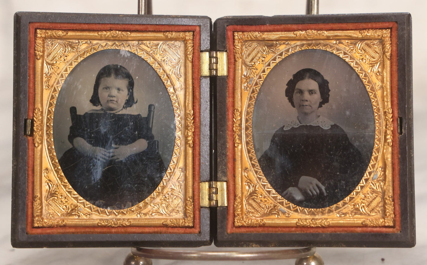 Lot 051 - Pair Of Antique 1/9th Plate Ruby Ambrotype Photographs Of Chubby Young Girl And Older Woman, Possibly Mother And Daughter, In Littlefield, Parsons & Co. Double Thermoplastic Union Case Patented 1856–1857, Note Crack To One Image