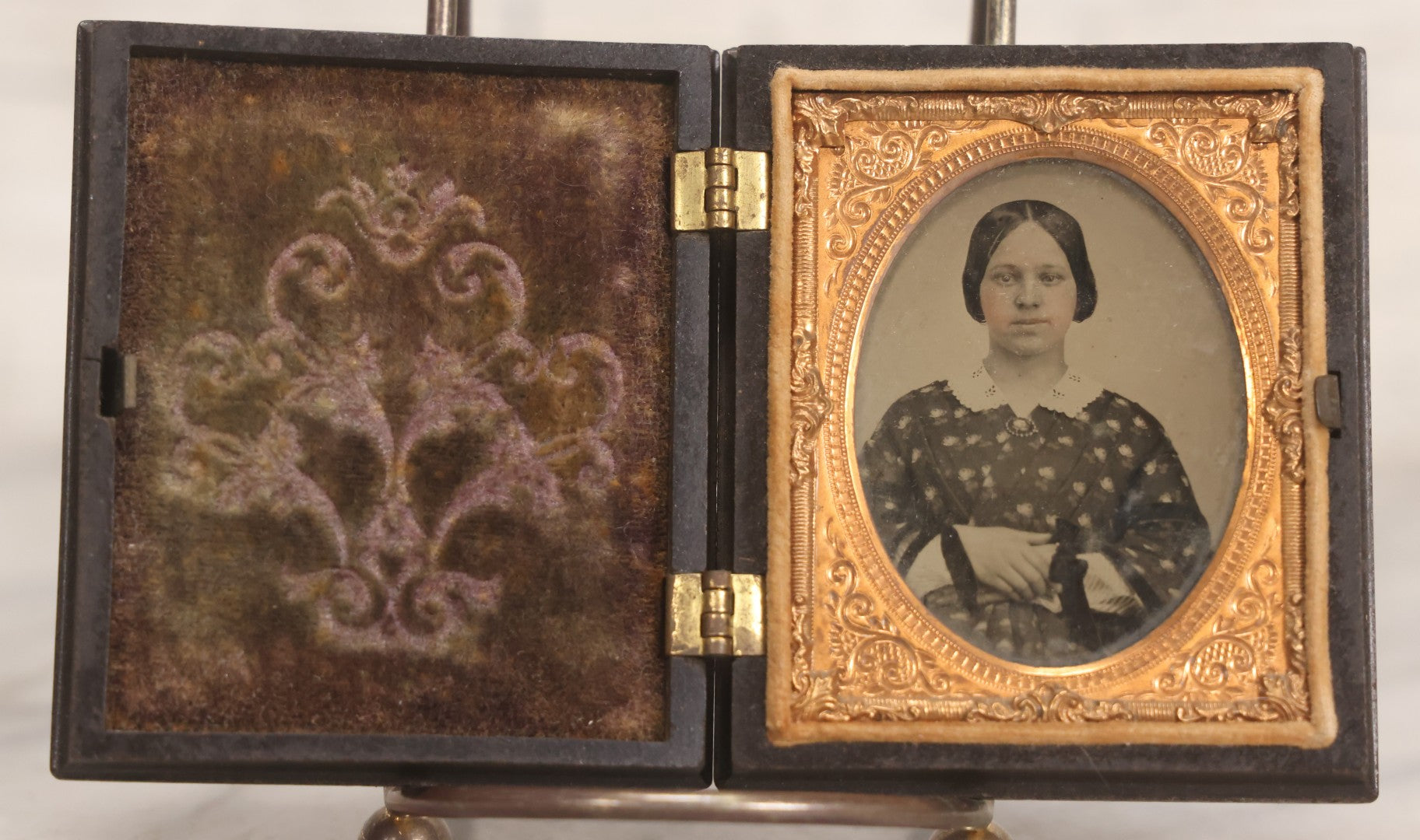 Lot 052 - Antique 1/9th Plate Ambrotype Photograph Of Young Woman In Flower-Patterned Dress In Thermoplastic Union Case Patented By S. Peck 1854 And H. Halverson 1855
