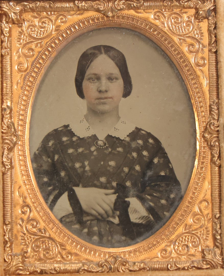Lot 052 - Antique 1/9th Plate Ambrotype Photograph Of Young Woman In Flower-Patterned Dress In Thermoplastic Union Case Patented By S. Peck 1854 And H. Halverson 1855