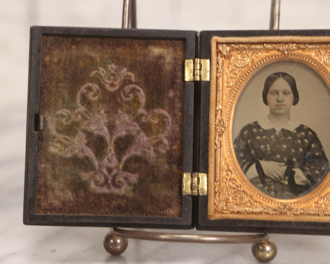 Lot 052 - Antique 1/9th Plate Ambrotype Photograph Of Young Woman In Flower-Patterned Dress In Thermoplastic Union Case Patented By S. Peck 1854 And H. Halverson 1855