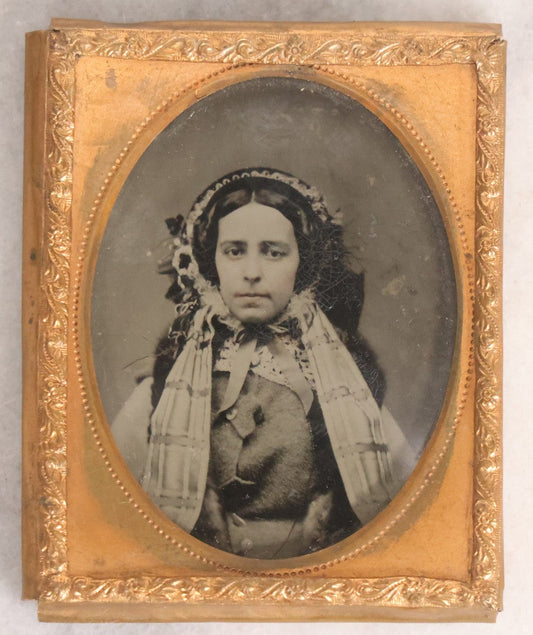 Lot 053 - Antique 1/9th Plate Ruby Ambrotype Photograph Of Pretty Young Woman In Elaborate Bonnet And Coat With Long Bonnet Ties Draped Across Chest, Uncased With Brass Mat And Preserver