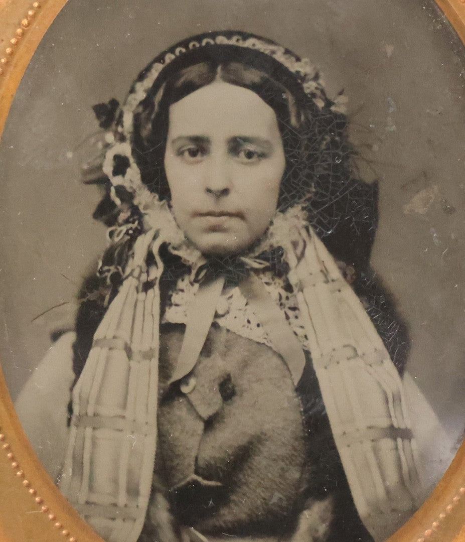Lot 053 - Antique 1/9th Plate Ruby Ambrotype Photograph Of Pretty Young Woman In Elaborate Bonnet And Coat With Long Bonnet Ties Draped Across Chest, Uncased With Brass Mat And Preserver