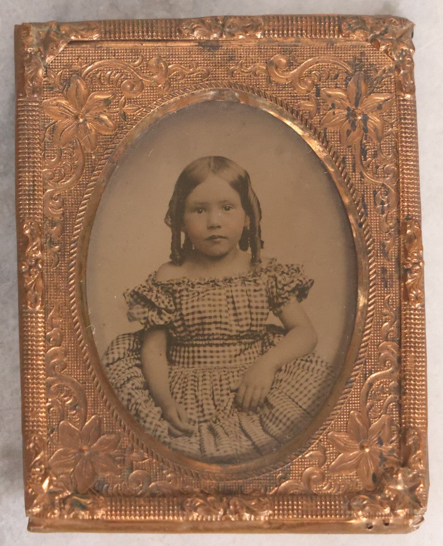 Lot 054 - Antique 1/9th Plate Ruby Ambrotype Photograph Of Pretty Young Girl With Blonde Curls In Checkered Off-Shoulder Dress, Uncased With Brass Mat And Preserver