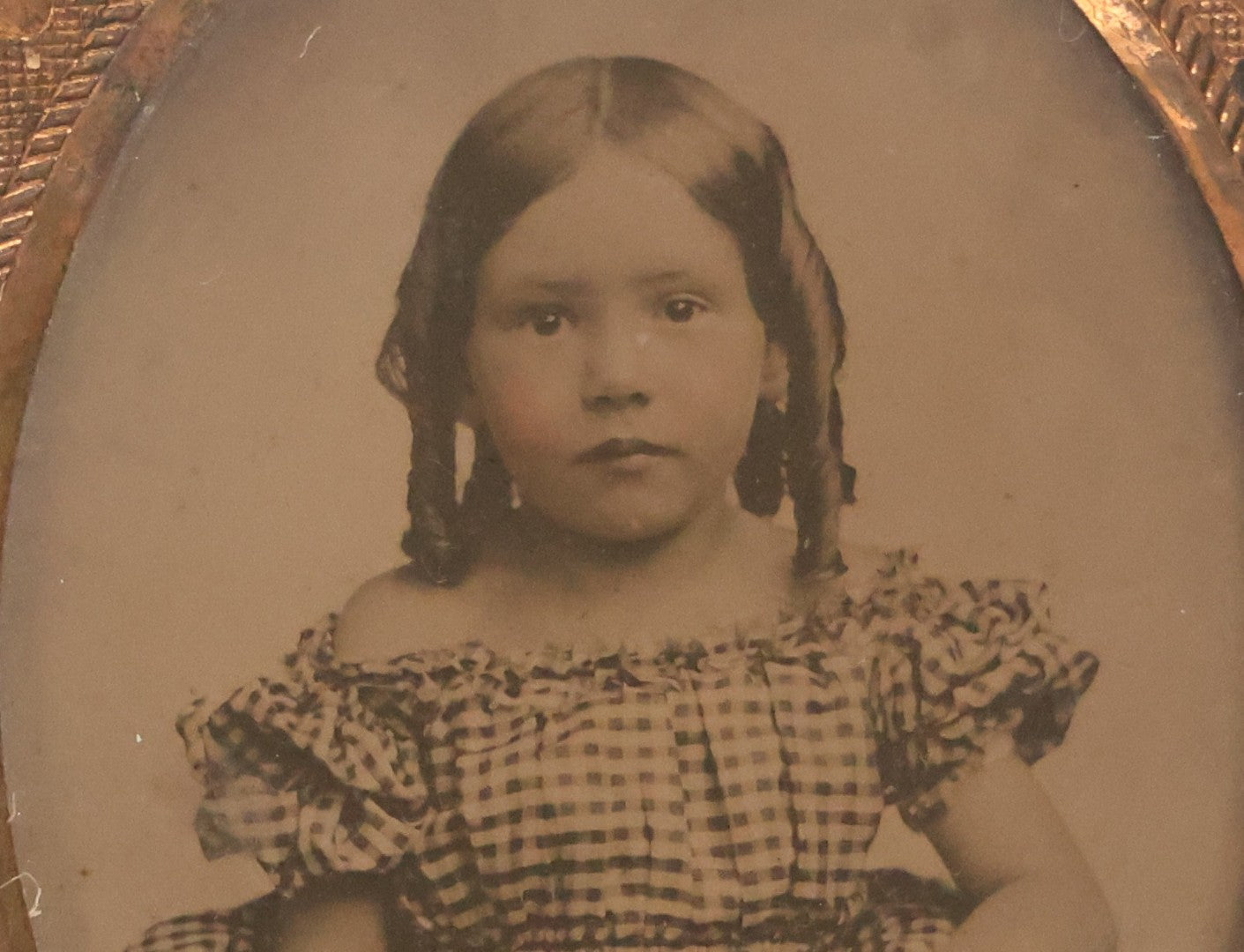 Lot 054 - Antique 1/9th Plate Ruby Ambrotype Photograph Of Pretty Young Girl With Blonde Curls In Checkered Off-Shoulder Dress, Uncased With Brass Mat And Preserver