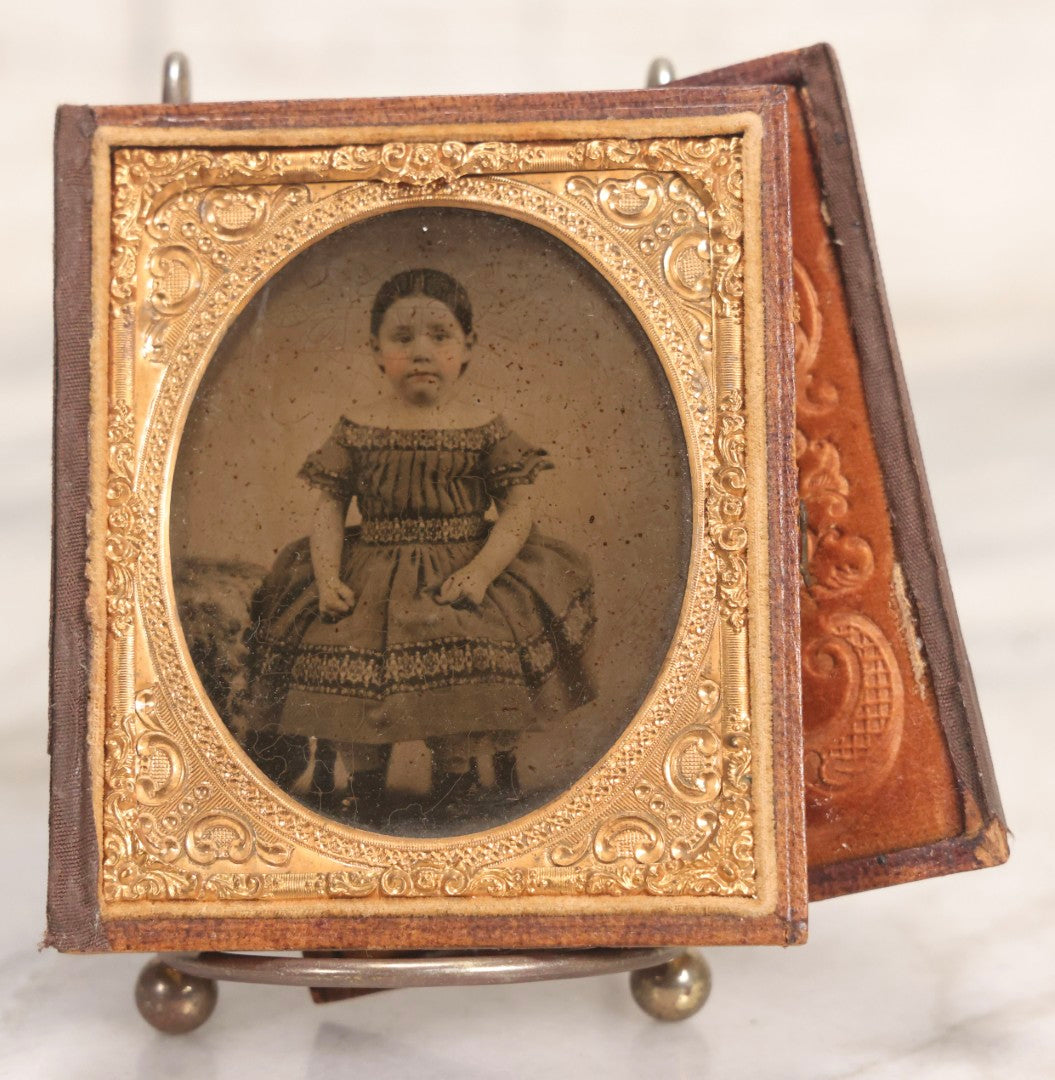 Lot 056 - Antique 1/6th Plate Ambrotype Photograph Of Impatient Little Girl In Off-Shoulder Dress In Full Split Leatherette Union Case With Bouquet And Birds Design