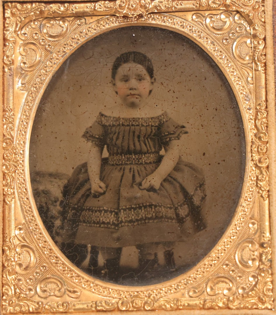 Lot 056 - Antique 1/6th Plate Ambrotype Photograph Of Impatient Little Girl In Off-Shoulder Dress In Full Split Leatherette Union Case With Bouquet And Birds Design