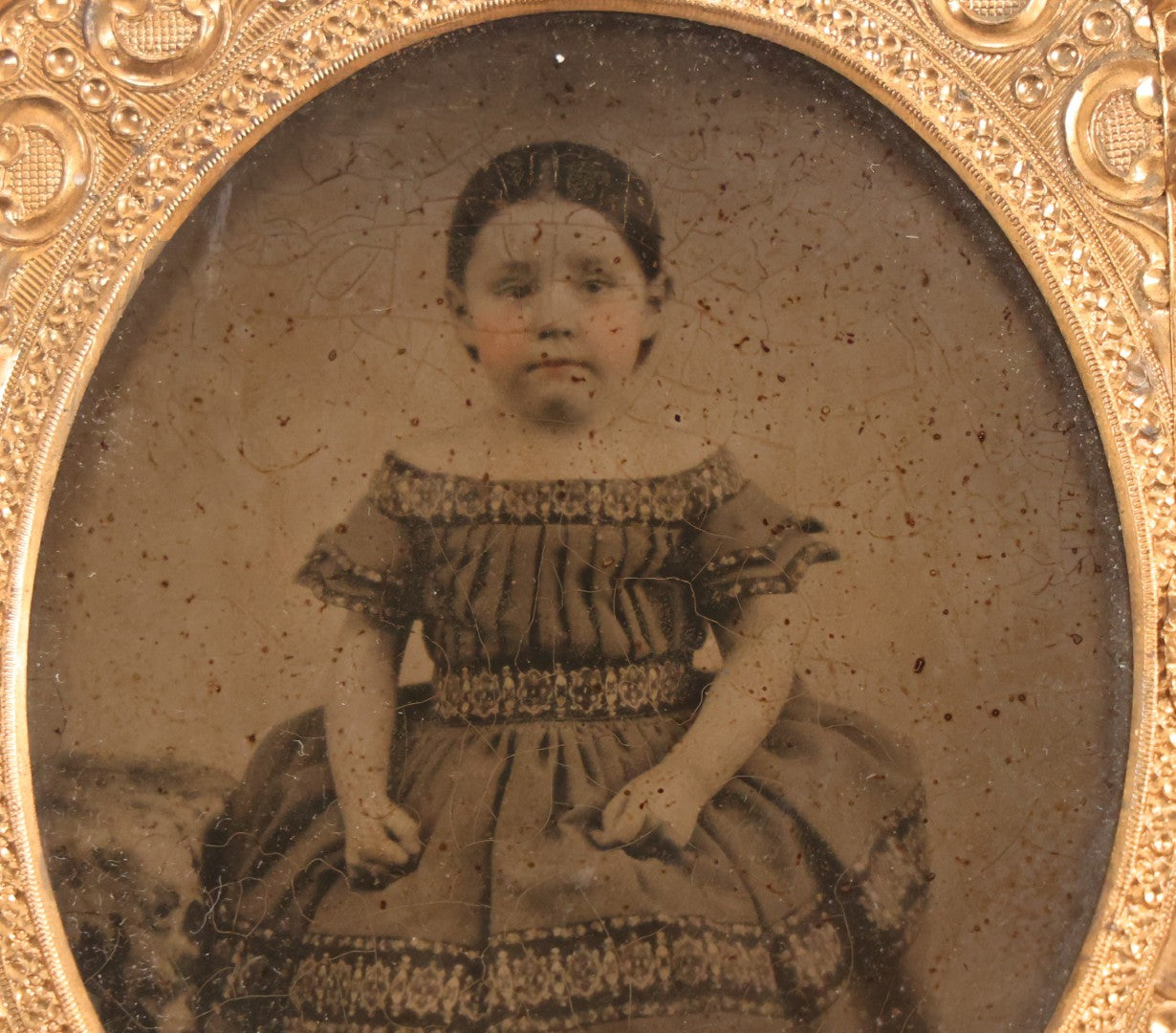 Lot 056 - Antique 1/6th Plate Ambrotype Photograph Of Impatient Little Girl In Off-Shoulder Dress In Full Split Leatherette Union Case With Bouquet And Birds Design