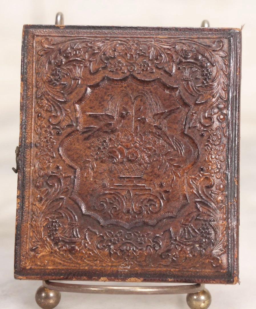 Lot 056 - Antique 1/6th Plate Ambrotype Photograph Of Impatient Little Girl In Off-Shoulder Dress In Full Split Leatherette Union Case With Bouquet And Birds Design