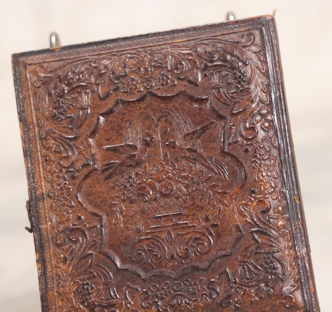 Lot 056 - Antique 1/6th Plate Ambrotype Photograph Of Impatient Little Girl In Off-Shoulder Dress In Full Split Leatherette Union Case With Bouquet And Birds Design
