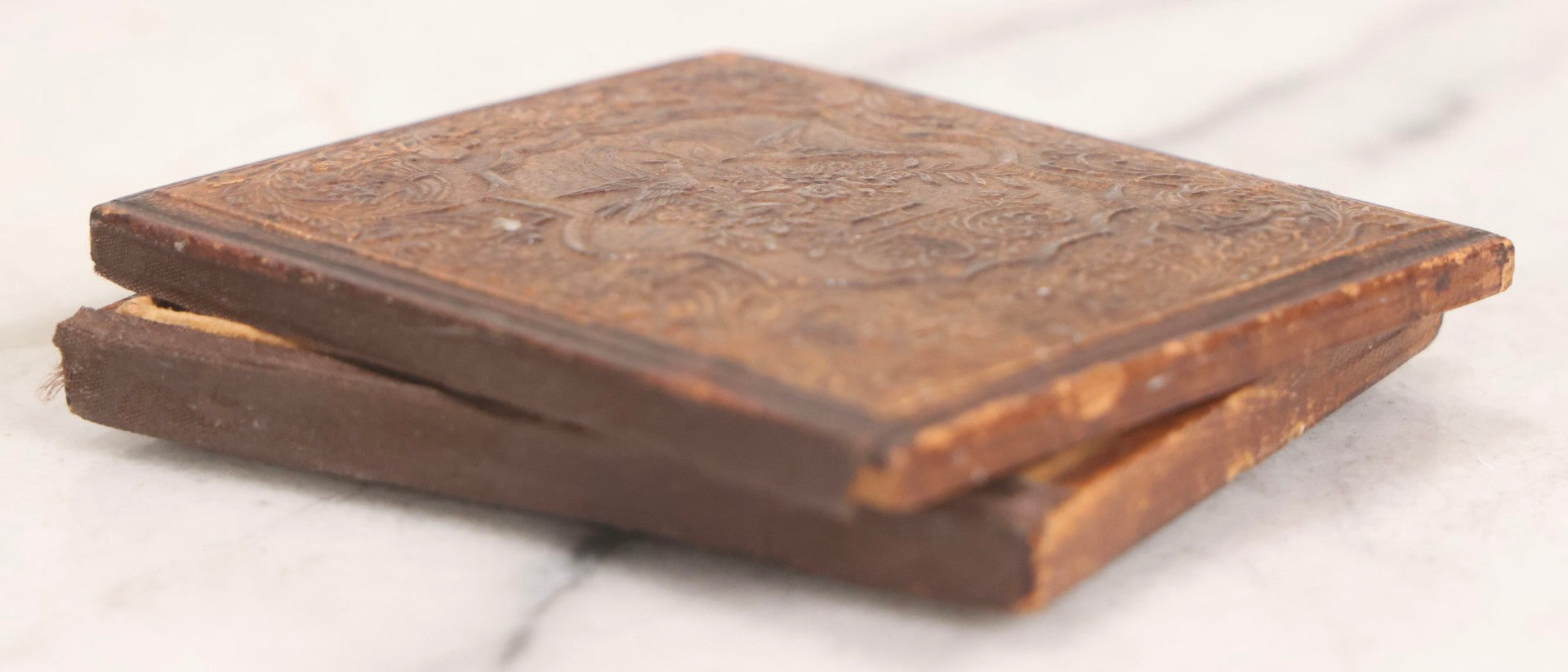 Lot 056 - Antique 1/6th Plate Ambrotype Photograph Of Impatient Little Girl In Off-Shoulder Dress In Full Split Leatherette Union Case With Bouquet And Birds Design