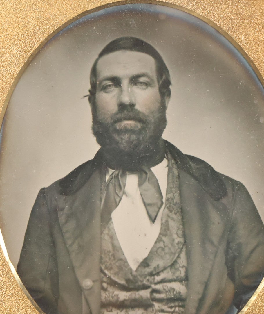 Lot 057 - Antique 1/6th Plate Ambrotype Photograph Of Bearded Man In Silk Neck Tie And Formal Dress, In Full Leatherette Union Case Repaired With Tape Hinge