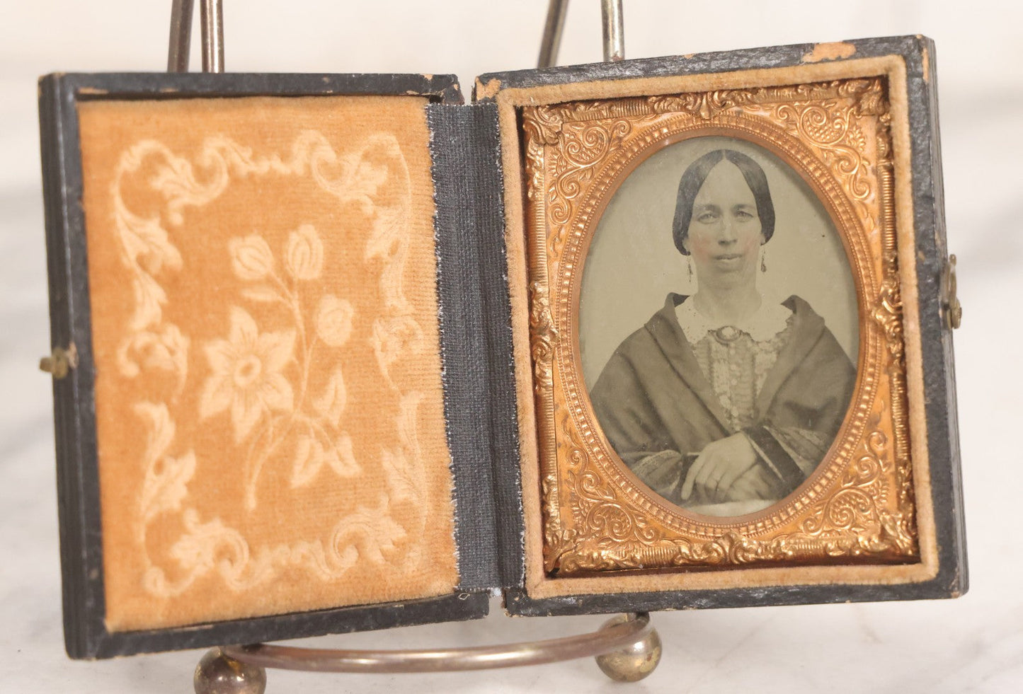 Lot 058 - Antique 1/9th Plate Hand-Tinted Ambrotype Photograph Of Woman With Shawl And Jewelry, In Full Leatherette Union Case Repaired With Taped Hinge