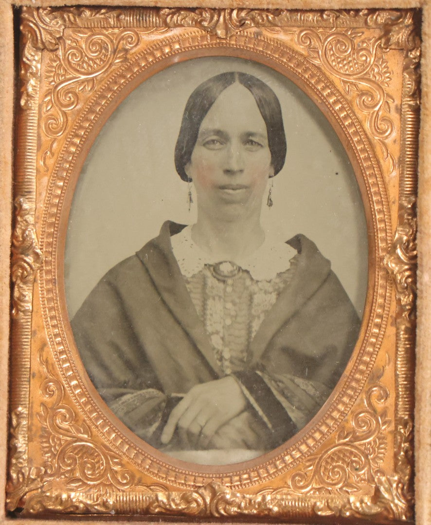 Lot 058 - Antique 1/9th Plate Hand-Tinted Ambrotype Photograph Of Woman With Shawl And Jewelry, In Full Leatherette Union Case Repaired With Taped Hinge