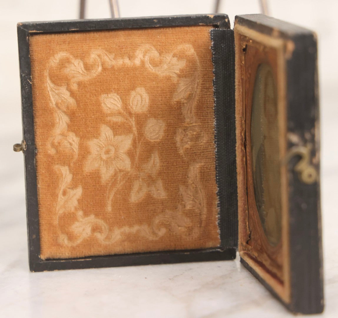 Lot 058 - Antique 1/9th Plate Hand-Tinted Ambrotype Photograph Of Woman With Shawl And Jewelry, In Full Leatherette Union Case Repaired With Taped Hinge