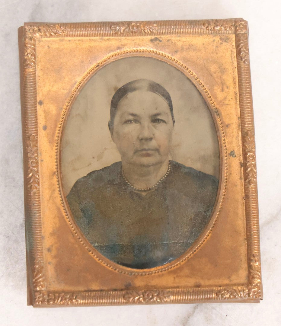 Lot 059 - Antique 1/9th Plate Ambrotype Photograph Of Older Woman, Under Glass With Brass Mat And Preserver, Note Tarnish And Staining