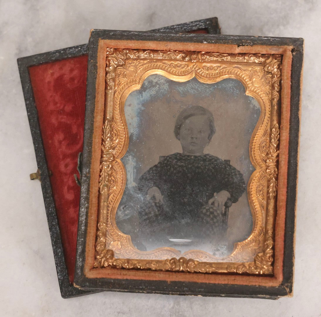 Lot 062 - Trio Of Antique 1/9th Plate Ruby Ambrotype Photographs Including Little Girl In Dress, Elderly Woman With Tied-Back Curls, And Stoic Little Boy, In Mixed Cases