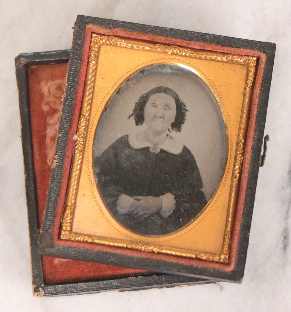 Lot 062 - Trio Of Antique 1/9th Plate Ruby Ambrotype Photographs Including Little Girl In Dress, Elderly Woman With Tied-Back Curls, And Stoic Little Boy, In Mixed Cases