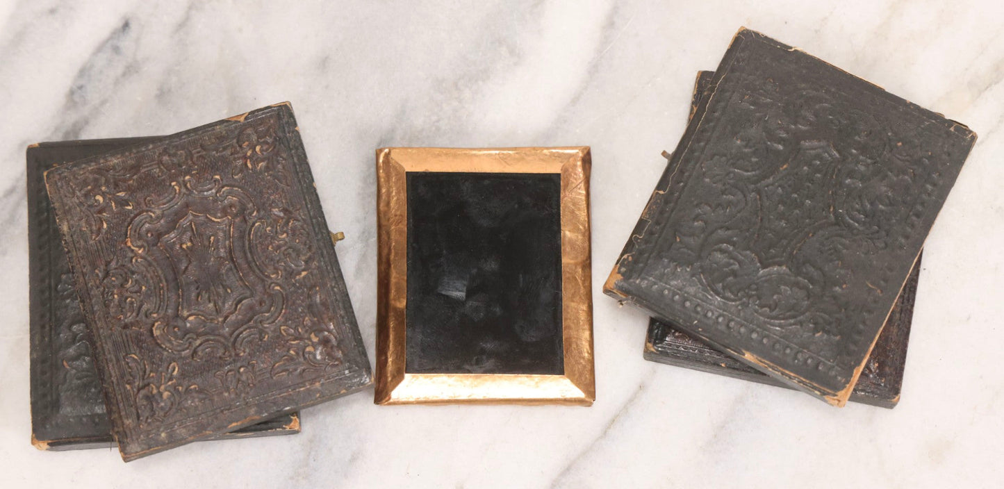 Lot 062 - Trio Of Antique 1/9th Plate Ruby Ambrotype Photographs Including Little Girl In Dress, Elderly Woman With Tied-Back Curls, And Stoic Little Boy, In Mixed Cases