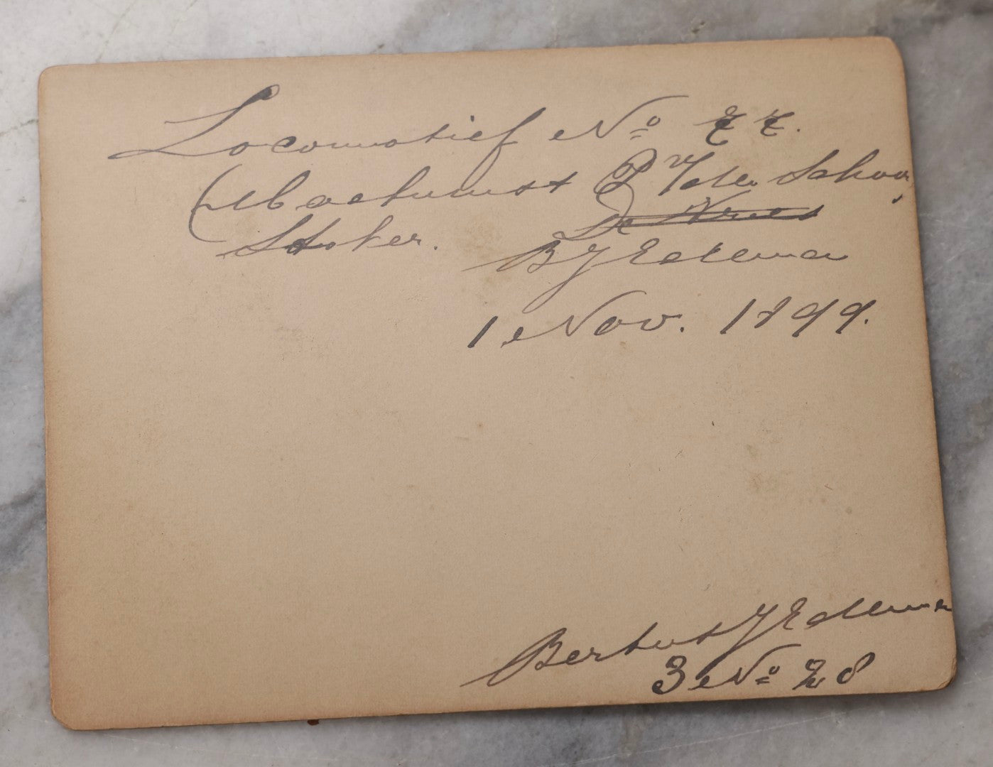 Lot 078 - Trio Of Antique Boarded Photographs Of Men Posing In Front Of Late 19th-Century Locomotives, Including Locomotive No. 77, With German Handwritten Notes On Verso Dated 1899