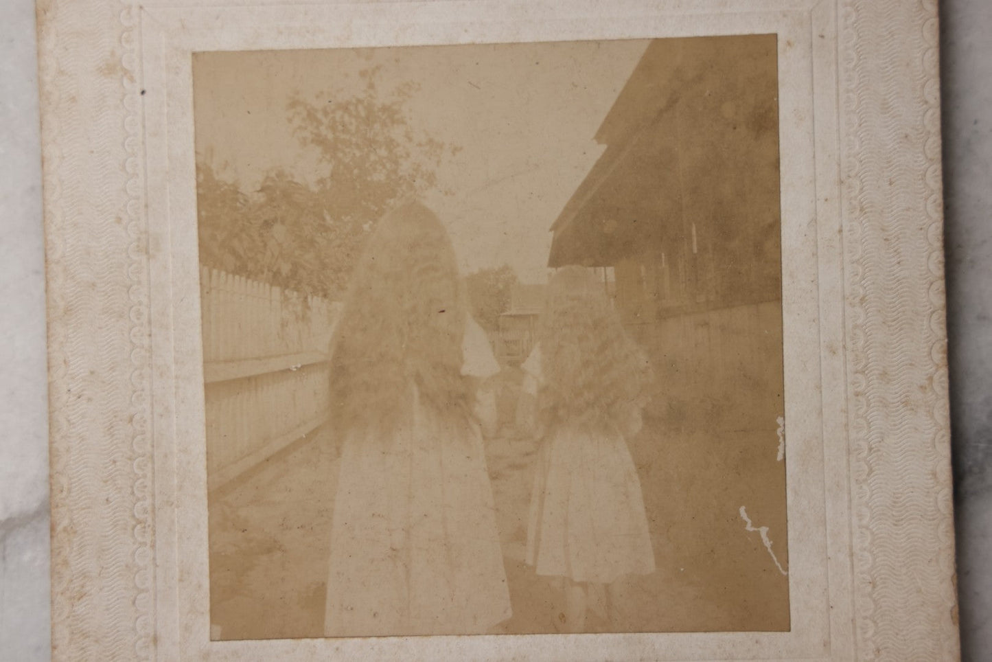 Lot 081 - Antique Boarded Photograph Of Two Girls With Matching Long Wavy Hair, Identified As "Alice Cook And Neffie Powell," With Humorous Note On Verso About Keeping “Snarls” Out Of Their Hair