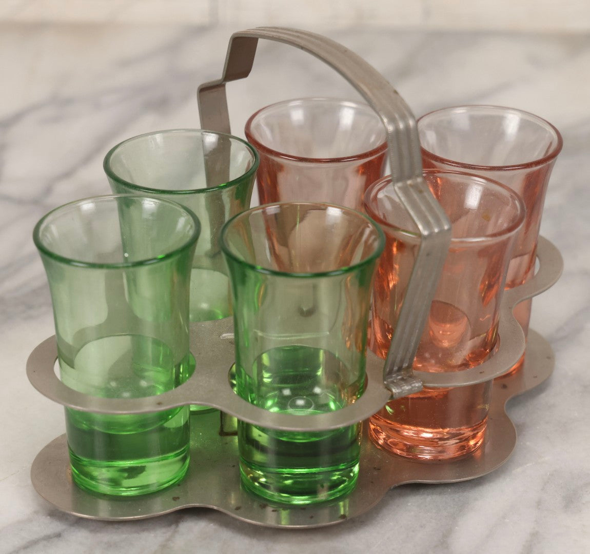 Lot 090 - Vintage Chrome Art Deco Shot Glass Caddy With Six Double Shot Glasses, Three Uranium Glass And Three Pink Depression Glass, Circa 1930s–1940s