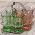 Lot 090 - Vintage Chrome Art Deco Shot Glass Caddy With Six Double Shot Glasses, Three Uranium Glass And Three Pink Depression Glass, Circa 1930s–1940s
