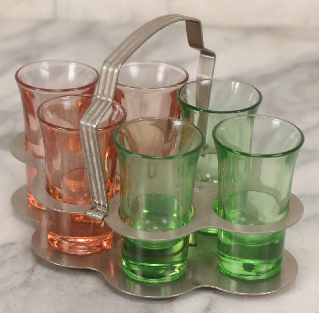 Lot 090 - Vintage Chrome Art Deco Shot Glass Caddy With Six Double Shot Glasses, Three Uranium Glass And Three Pink Depression Glass, Circa 1930s–1940s