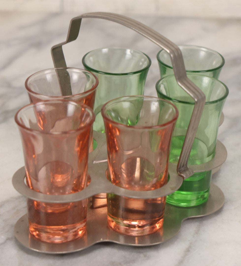 Lot 090 - Vintage Chrome Art Deco Shot Glass Caddy With Six Double Shot Glasses, Three Uranium Glass And Three Pink Depression Glass, Circa 1930s–1940s