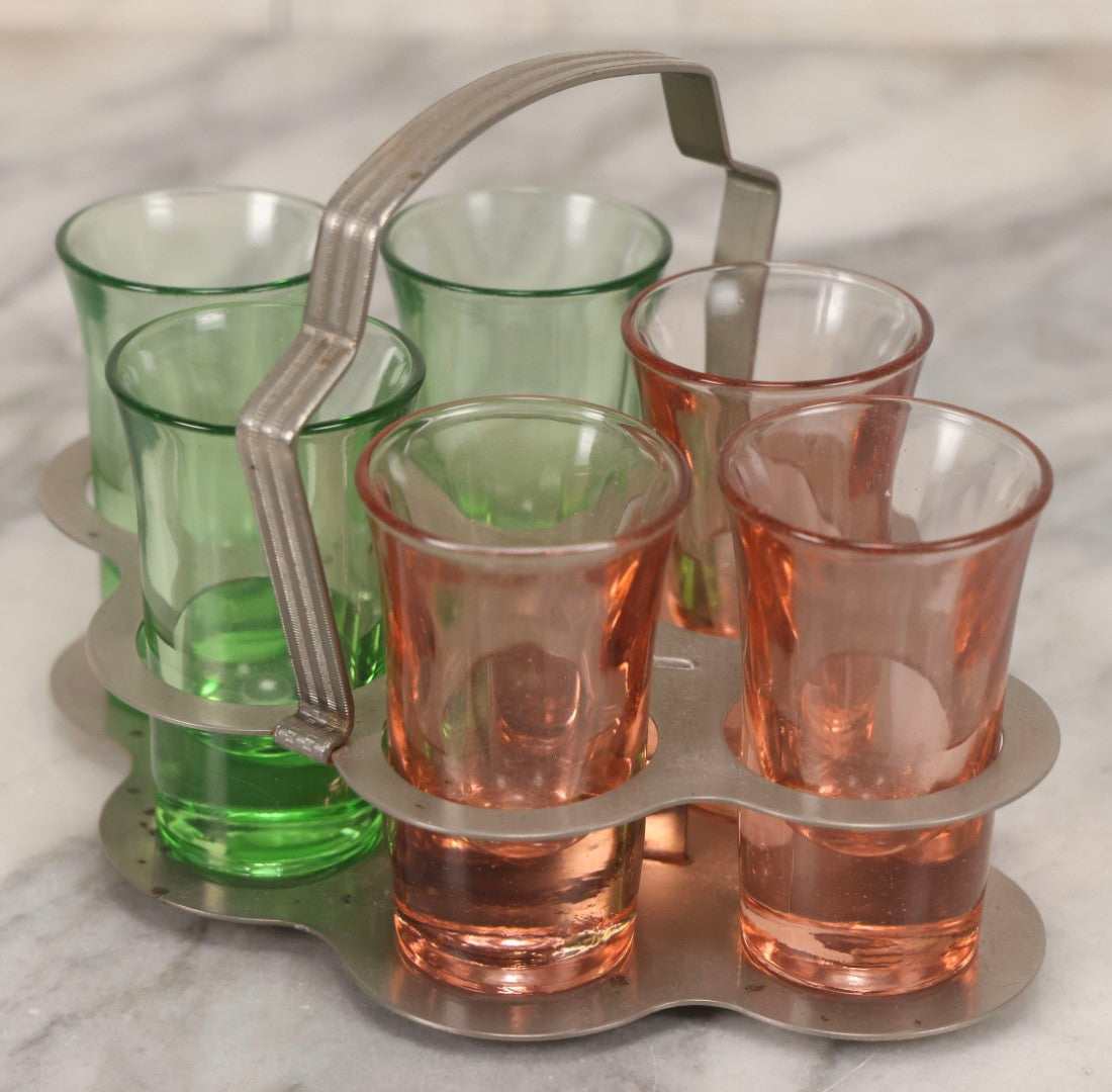 Lot 090 - Vintage Chrome Art Deco Shot Glass Caddy With Six Double Shot Glasses, Three Uranium Glass And Three Pink Depression Glass, Circa 1930s–1940s