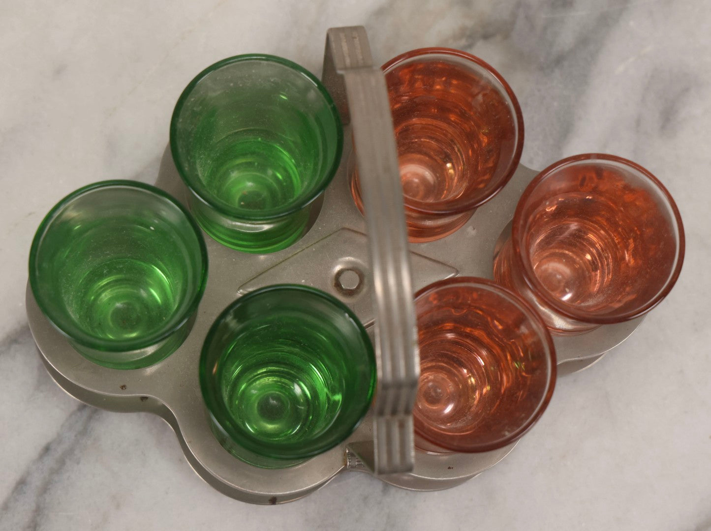 Lot 090 - Vintage Chrome Art Deco Shot Glass Caddy With Six Double Shot Glasses, Three Uranium Glass And Three Pink Depression Glass, Circa 1930s–1940s