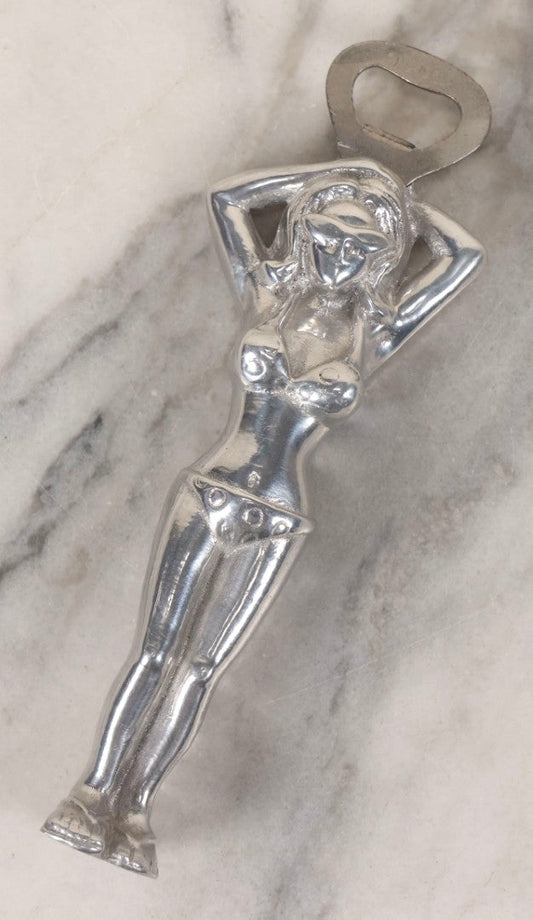 Lot 094 - Vintage Cast Aluminum Bikini Babe Bottle Opener, Woman With Sunglasses And Polka Dot Bikini, Circa 1980s 7-3/4" L