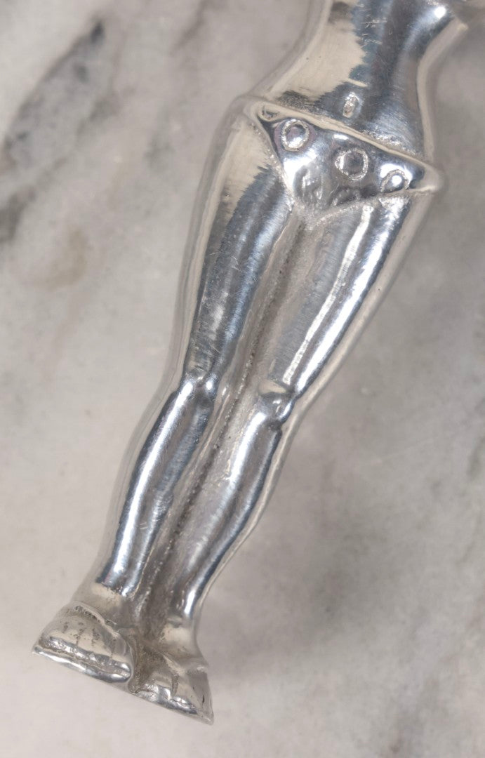 Lot 094 - Vintage Cast Aluminum Bikini Babe Bottle Opener, Woman With Sunglasses And Polka Dot Bikini, Circa 1980s 7-3/4" L