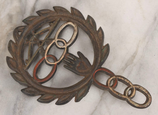 Lot 112 - Vintage Reproduction Cast Iron Odd Fellows I.O.O.F.. Trivet With Three Links, F.L.T., And Heart-In-Hand, Marked Wilton, Circa Mid-20th Century