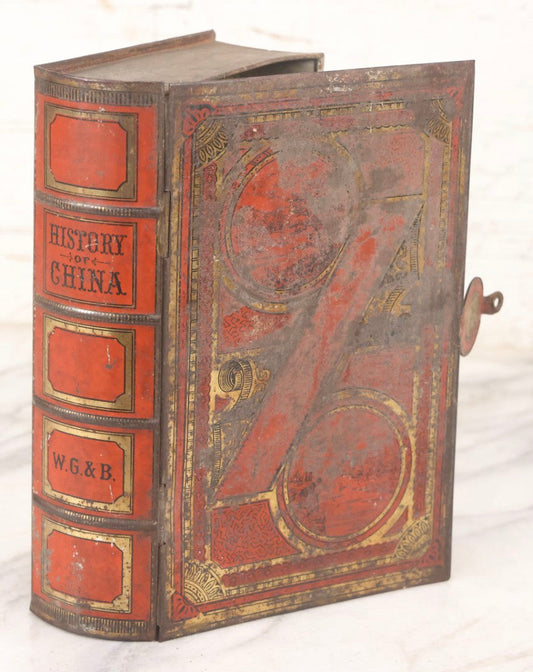 Lot 117 - Antique Tin Lithograph Book Safe In The Form Of Book Titled "History Of China," Marked "W.G. & B." On Spine
