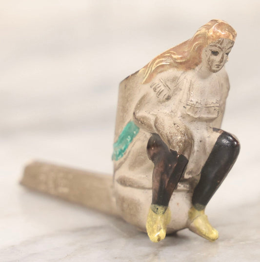 Lot 132 - Antique Painted Clay Figural Pipe Of A Busty Blonde Woman Sitting On A Chamber Pot, Stamped L. Fiolet, St. Omer, France, Note Stem Broken, 3-1/8" L