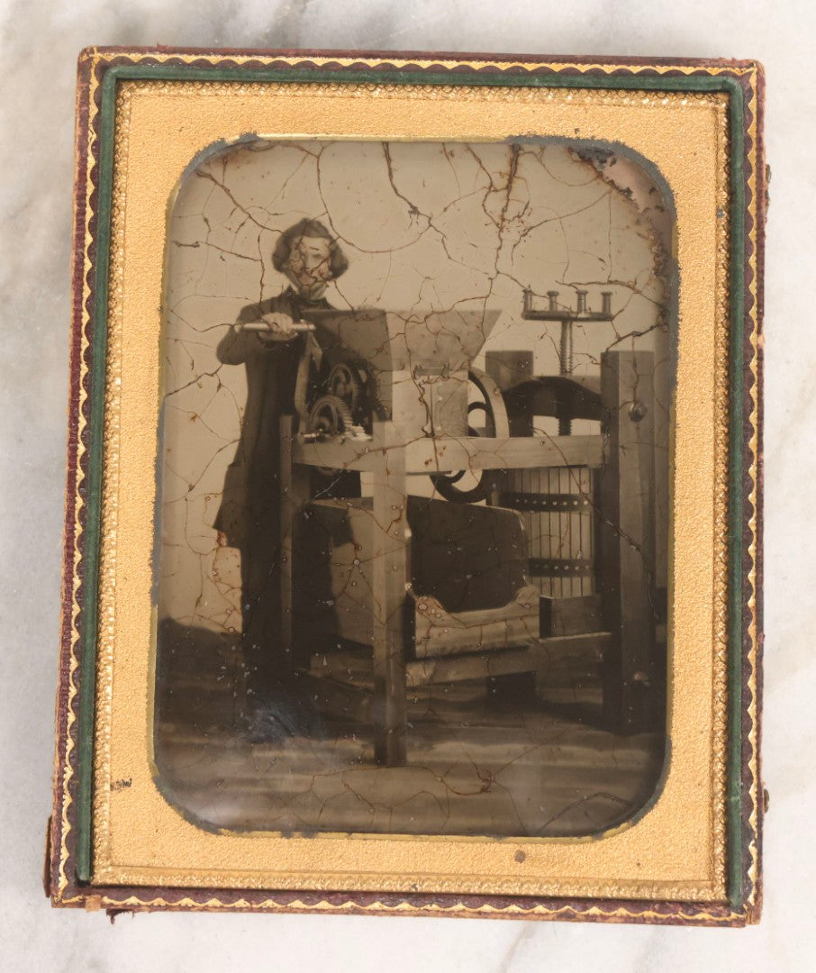 Lot 001 - Antique Half Plate Ambrotype Occupational Photograph Of Man Operating Apple Grinder And Cider Press, In Full Split Leatherette Case