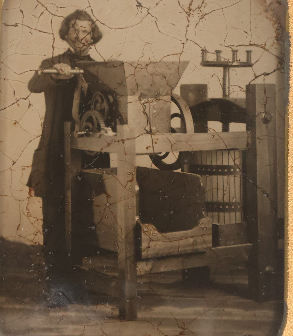 Lot 001 - Antique Half Plate Ambrotype Occupational Photograph Of Man Operating Apple Grinder And Cider Press, In Full Split Leatherette Case