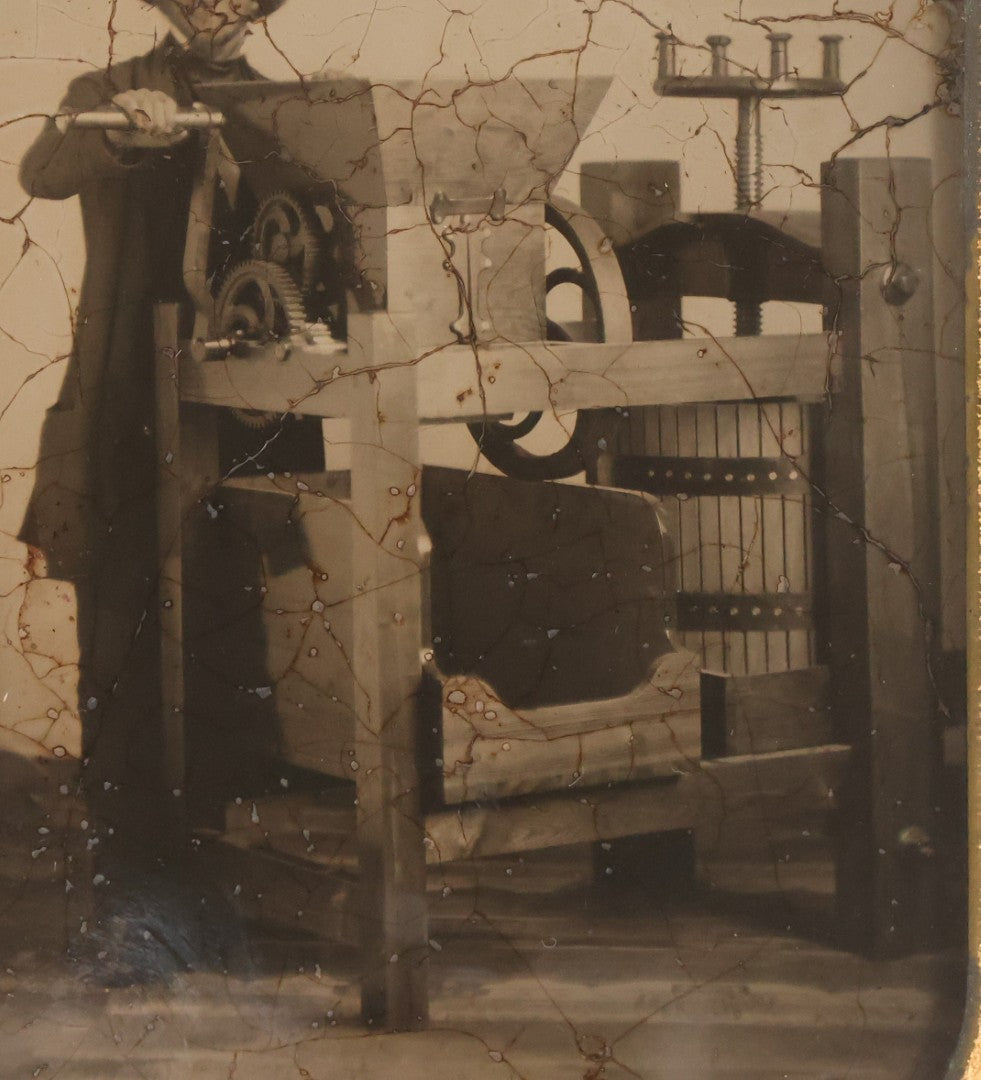 Lot 001 - Antique Half Plate Ambrotype Occupational Photograph Of Man Operating Apple Grinder And Cider Press, In Full Split Leatherette Case