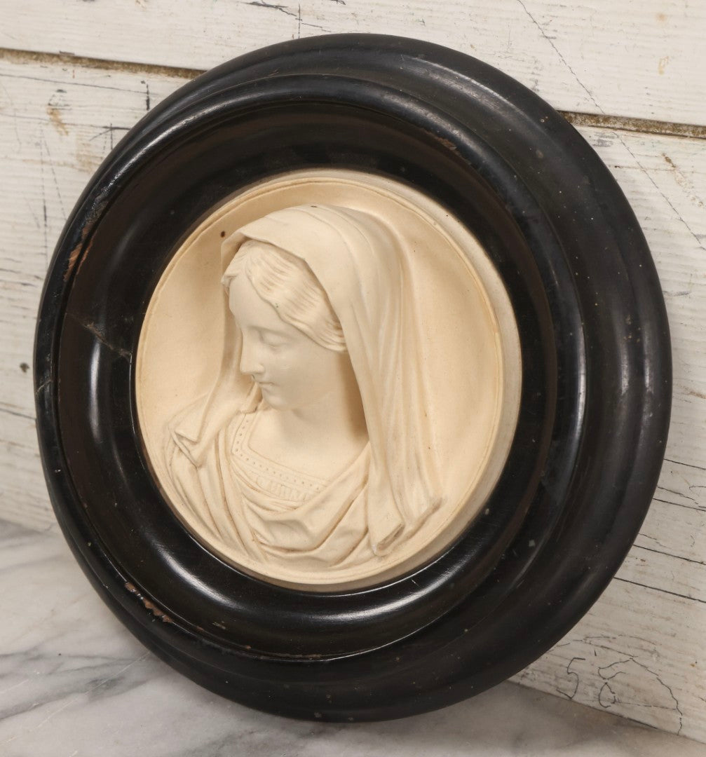 Lot 006 - Antique Carved Meerschaum Plaque Of The Virgin Mary In Black Lacquered Wood Frame, Likely French, Early 20th Century, 10" Diameter