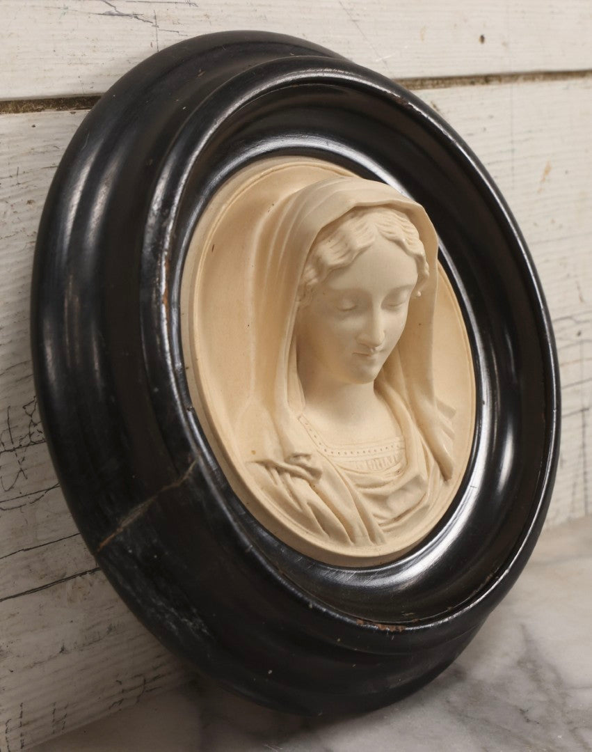 Lot 006 - Antique Carved Meerschaum Plaque Of The Virgin Mary In Black Lacquered Wood Frame, Likely French, Early 20th Century, 10" Diameter