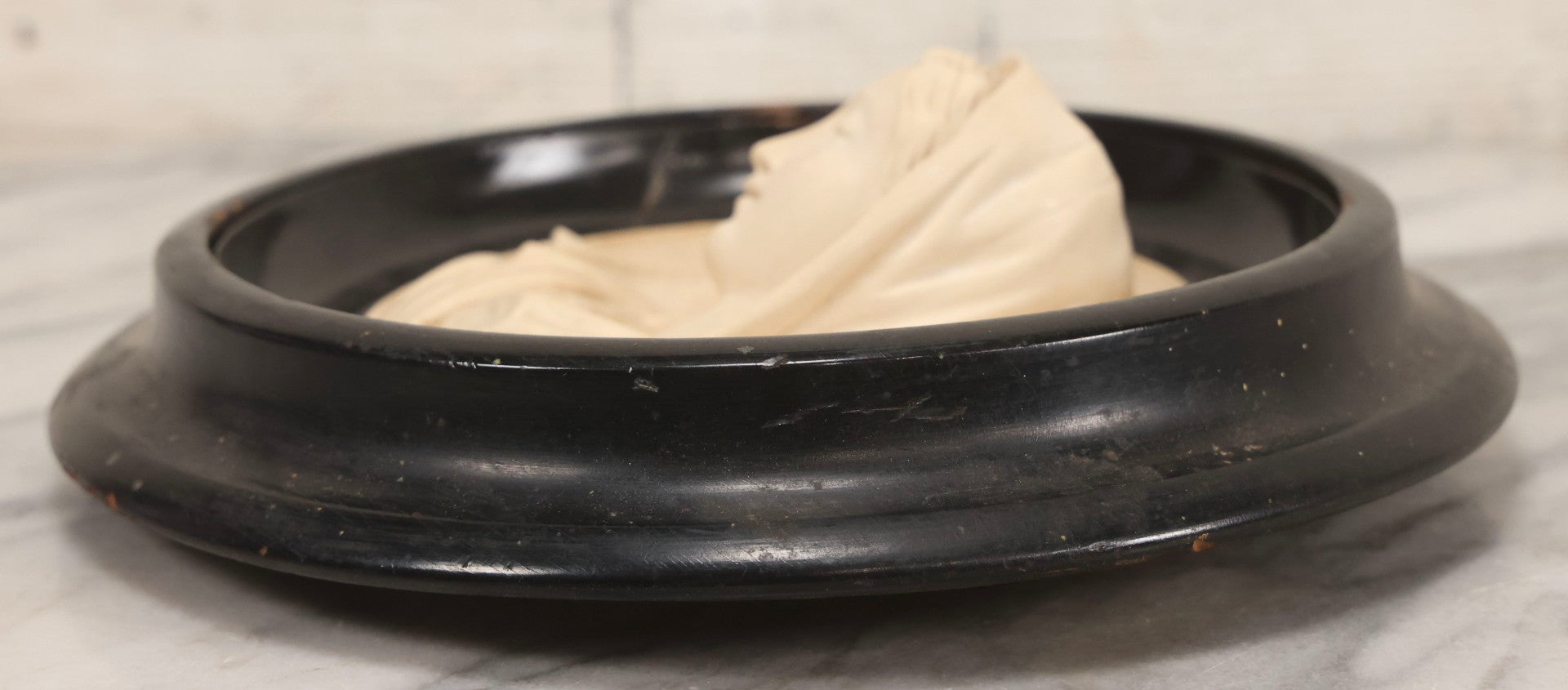 Lot 006 - Antique Carved Meerschaum Plaque Of The Virgin Mary In Black Lacquered Wood Frame, Likely French, Early 20th Century, 10" Diameter