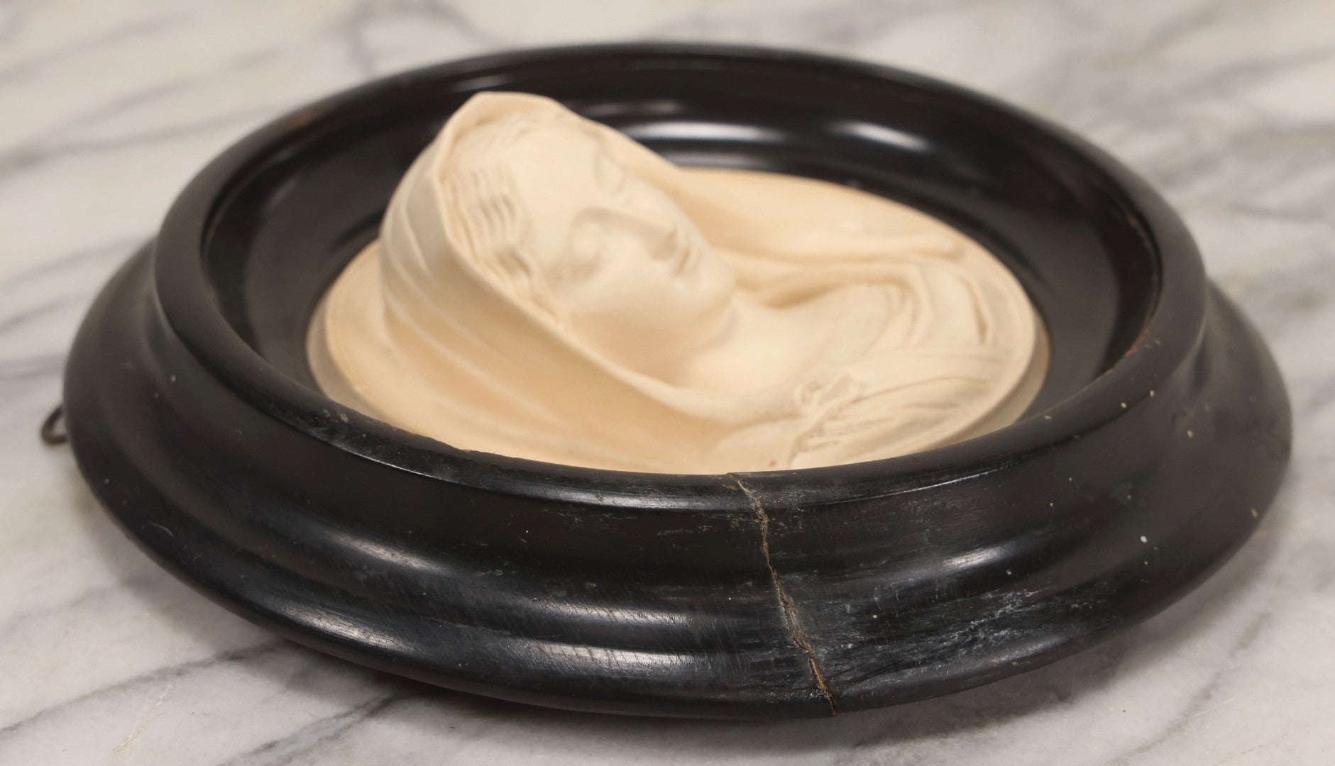 Lot 006 - Antique Carved Meerschaum Plaque Of The Virgin Mary In Black Lacquered Wood Frame, Likely French, Early 20th Century, 10" Diameter