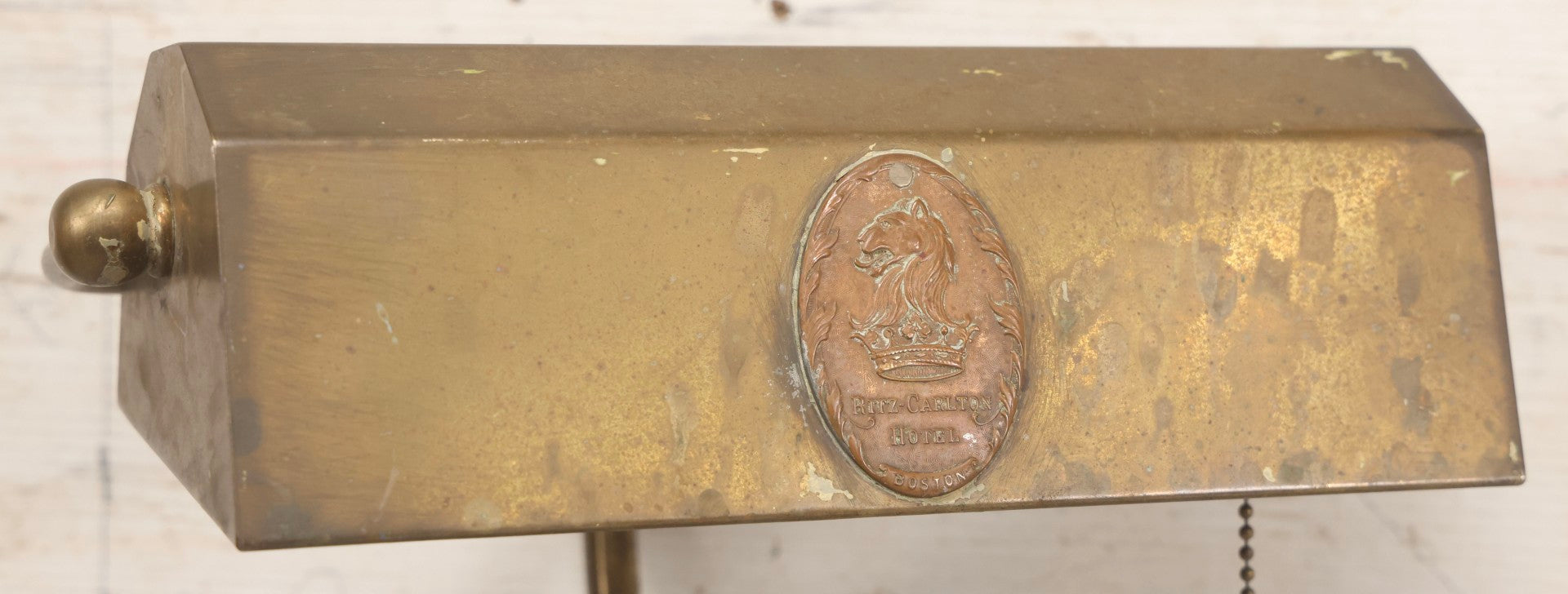 Lot 015 - Antique Brass Desk-Mount Light Fixture From The Ritz-Carlton Hotel, Boston, Massachusetts, With Lion And Crown Badge